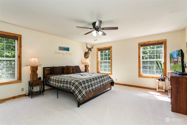 bedroom with ceiling fan and carpet floors