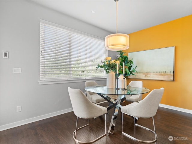 dining area with dark wood-type flooring