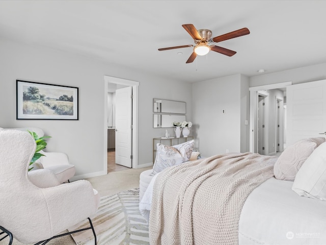 bedroom with ceiling fan and light colored carpet