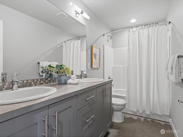 full bathroom with shower / bath combination with curtain, vanity, and toilet