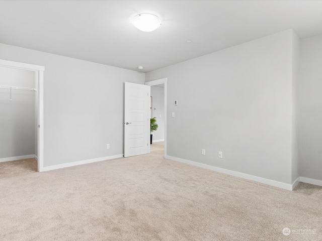 empty room featuring light colored carpet