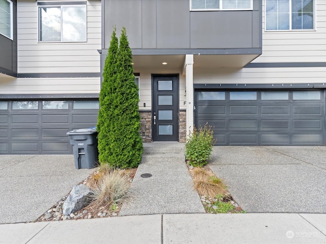 view of exterior entry featuring a garage