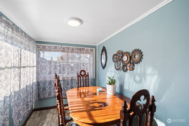 dining room with wood-type flooring and ornamental molding