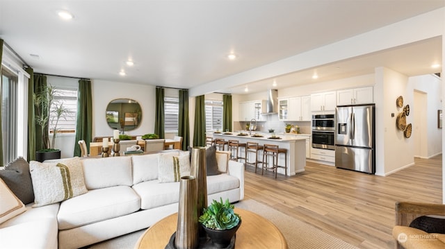 211 179th St SE, Bothell, WA 98021 - living area with light wood finished floors and recessed lighting