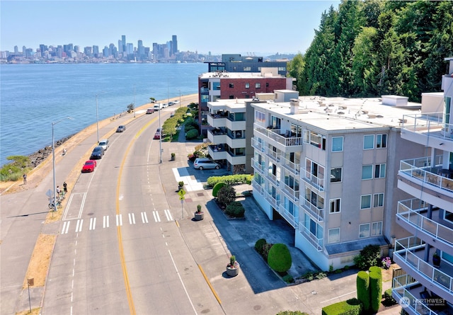 birds eye view of property with a water view