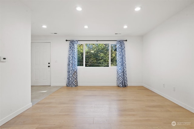 unfurnished room featuring light hardwood / wood-style flooring