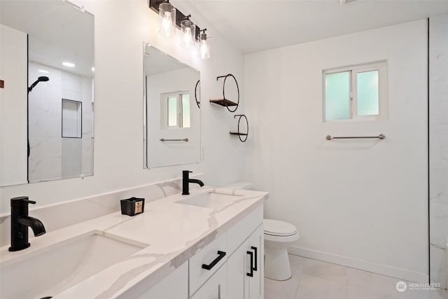 bathroom featuring vanity, a shower, and toilet