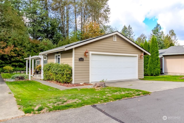 garage with a lawn and wooden walls