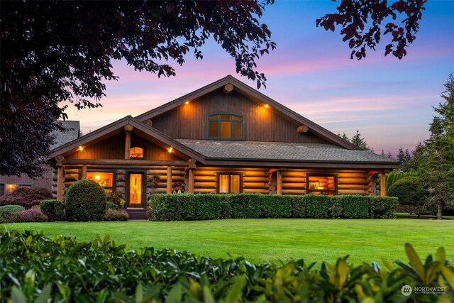 log-style house featuring a yard