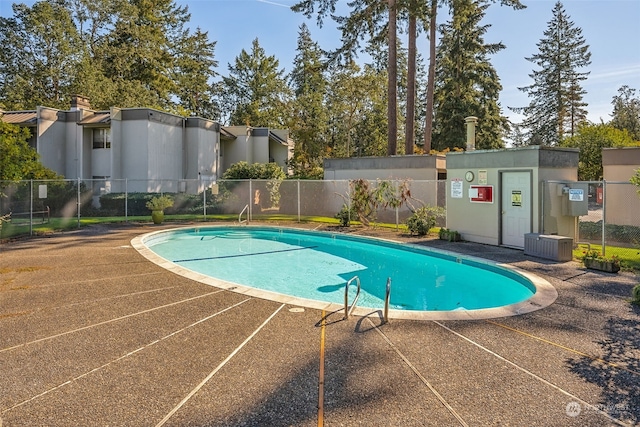 view of pool with central AC