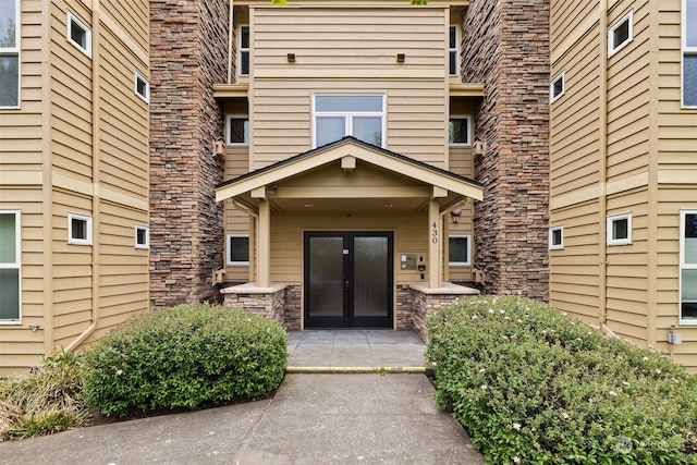 property entrance featuring french doors