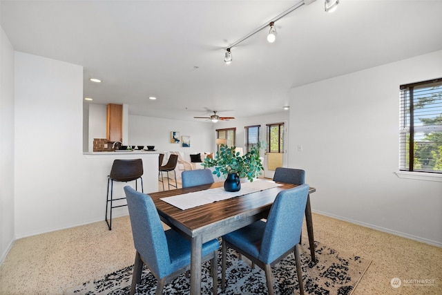 dining space featuring ceiling fan and track lighting