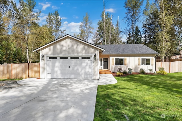 ranch-style home with a garage and a front lawn