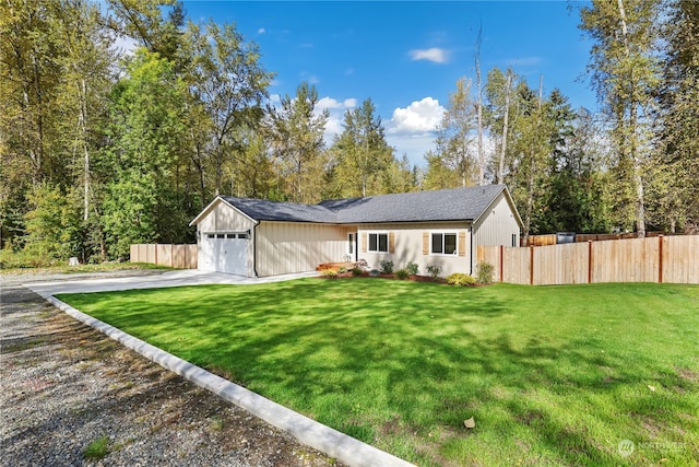 ranch-style home with a garage and a front lawn