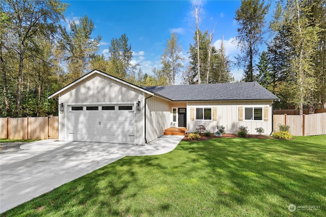 ranch-style home with a garage and a front lawn