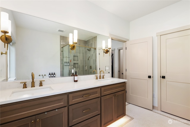 bathroom with vanity, tile patterned flooring, and a shower with shower door