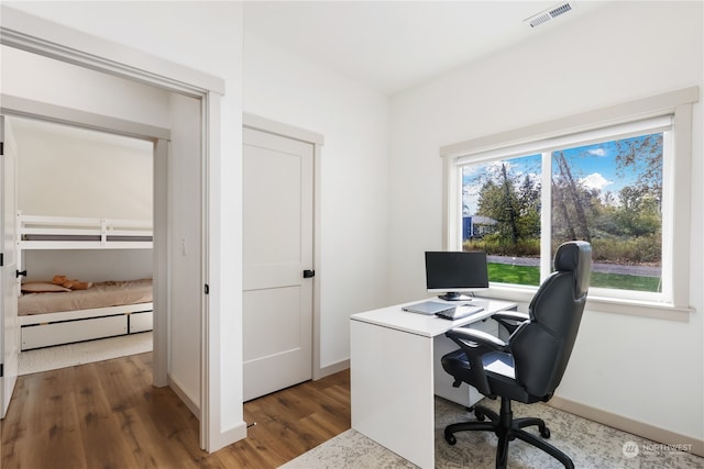 home office featuring dark hardwood / wood-style floors