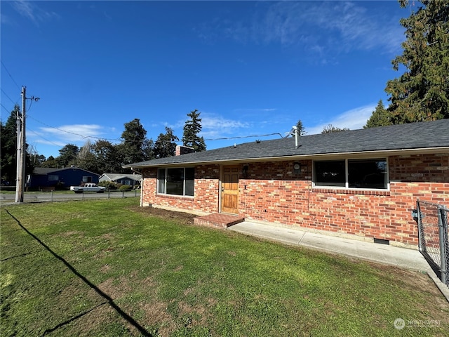 back of house with a yard