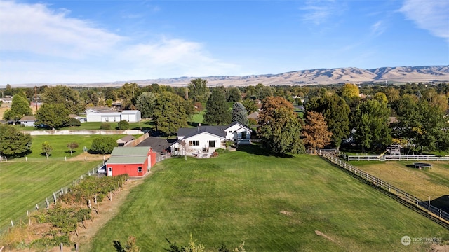 drone / aerial view featuring a mountain view and a rural view