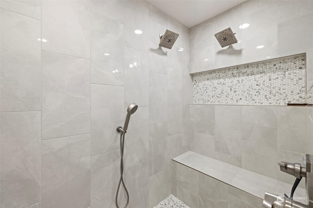 bathroom with tiled shower