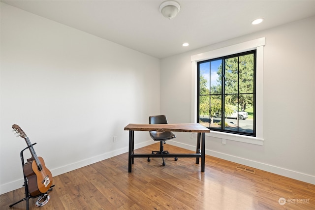 office area with hardwood / wood-style flooring