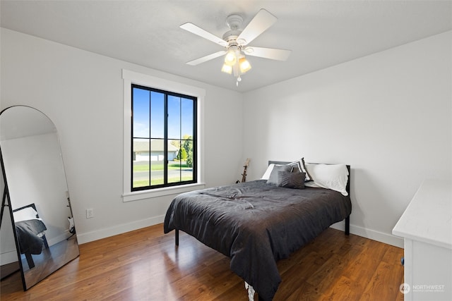 bedroom featuring wood-type flooring and ceiling fan