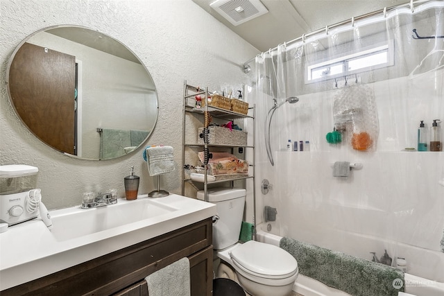 full bathroom with vanity, toilet, and shower / bath combination with curtain