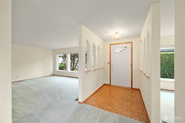 foyer featuring light parquet flooring