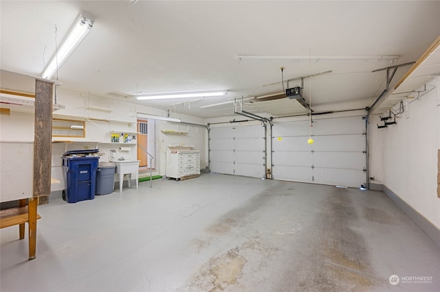 garage featuring a garage door opener