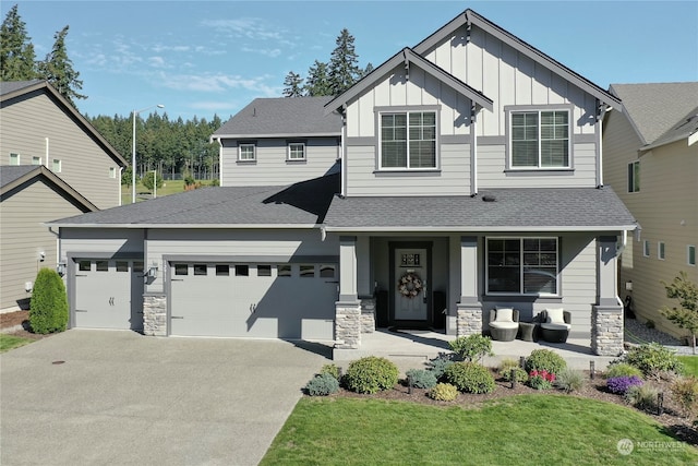 view of front of home with a garage and a front yard