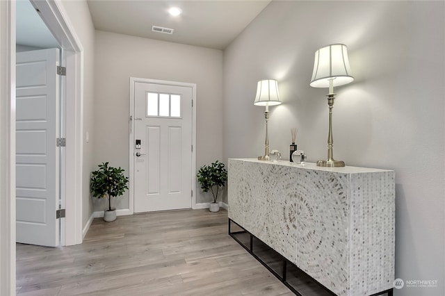 foyer with hardwood / wood-style flooring