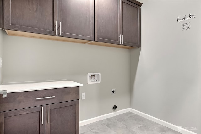 laundry room with light tile patterned flooring, hookup for a washing machine, hookup for an electric dryer, and cabinets