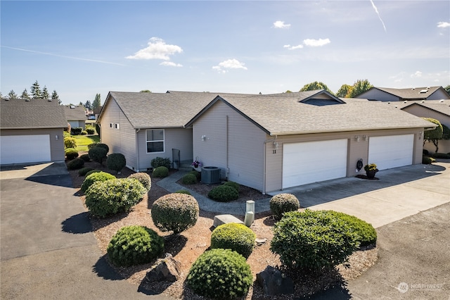 ranch-style home featuring a garage