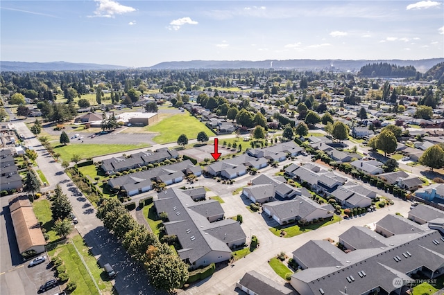 birds eye view of property with a mountain view