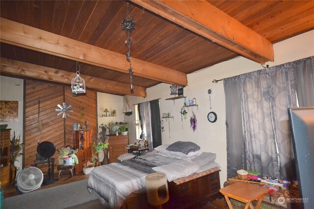 bedroom with beamed ceiling and wooden ceiling