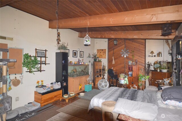 bedroom with beamed ceiling and wood ceiling