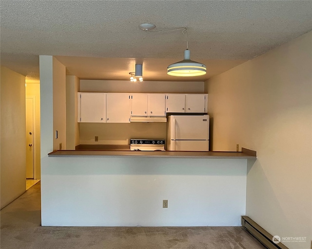 kitchen featuring white cabinetry, decorative light fixtures, a baseboard heating unit, and white appliances