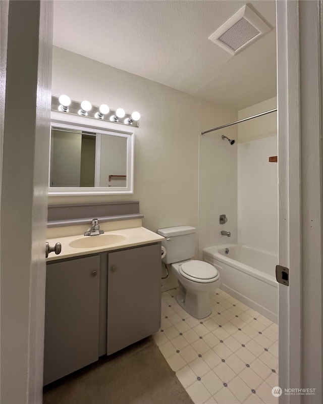 full bathroom with toilet, vanity,  shower combination, and tile patterned flooring