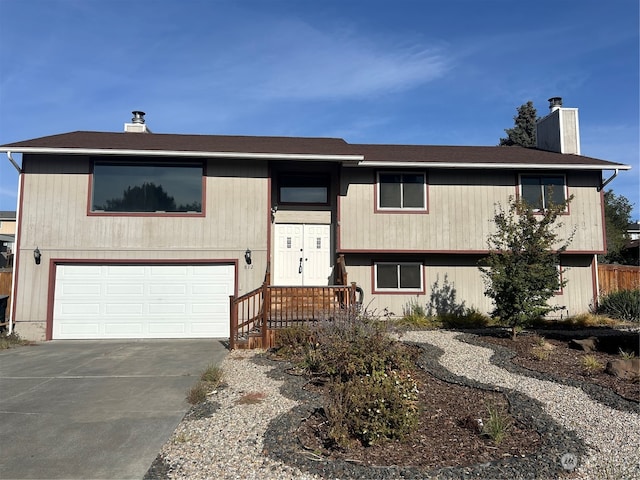 bi-level home featuring a garage