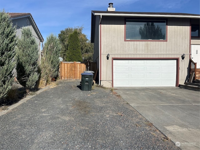 view of side of property with a garage