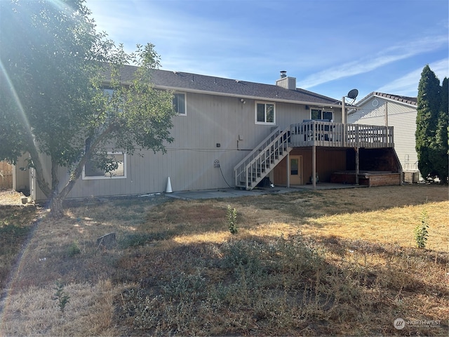 back of house featuring a deck