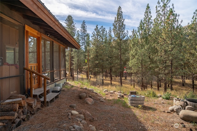 view of yard featuring a sunroom