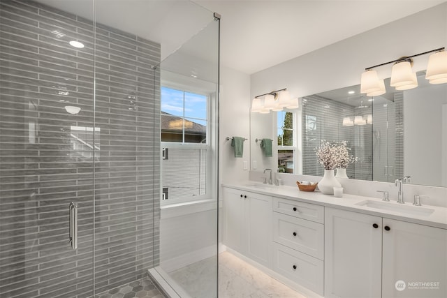 bathroom featuring vanity and an enclosed shower