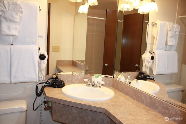 bathroom with toilet and vanity