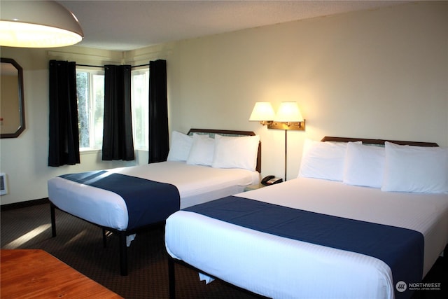 carpeted bedroom with baseboards