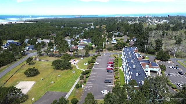 birds eye view of property with a forest view