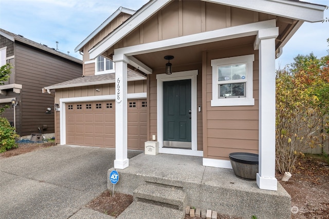 view of exterior entry with a garage