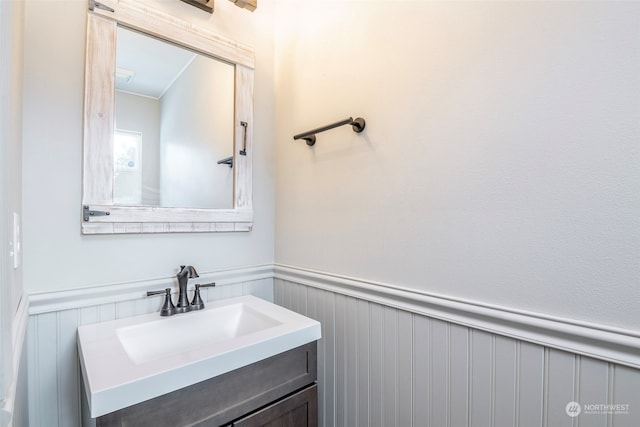 bathroom featuring vanity and crown molding