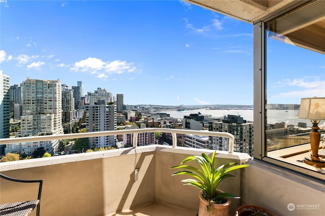 balcony featuring a water view