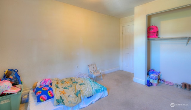 bedroom featuring light carpet